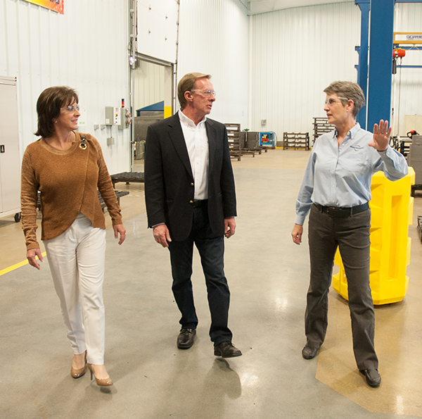 consultant explaining topic on factory floor